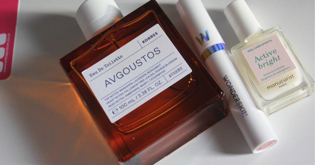 A collection of cosmetic products including a perfume, lipstick and nail polish that were purchased from adverting that worked.